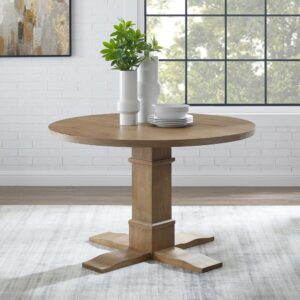 Achieve the look of laid-back elegance with the Joanna Round Dining Table. The substantial pedestal base and natural finish offer a blend of classic style and rustic chic. Both charming and spacious
