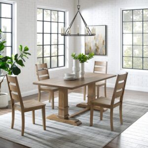 offering seating for four diners. Each chair features wide ladder back slats and contoured wood seats. Balancing the table’s substantial trestle base is a spacious tabletop