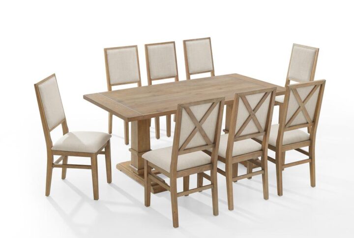 Gather together in modern farmhouse style with the Joanna 9pc Dining Set. The large rectangle trestle table pairs beautifully with the upholstered dining chairs