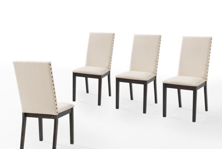 The Hayden 4-Piece Dining Chair Set brings elegant Parsons style to your dining space. With a neutral crème fabric on both the seat and chair backs
