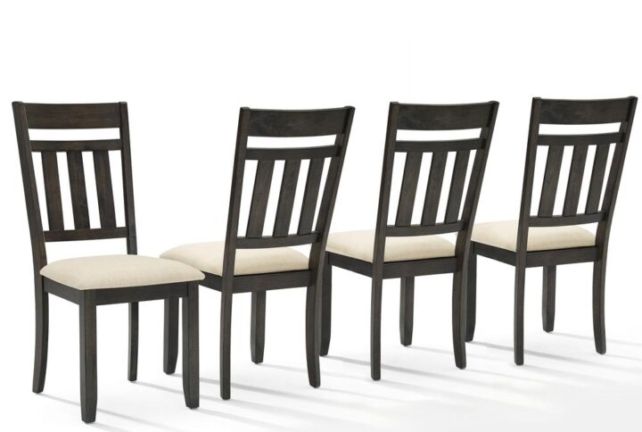 The Hayden 4-Piece Dining Chair Set has a modern farmhouse design that brings rustic style to family gatherings. Featuring a slat back and upholstered seat