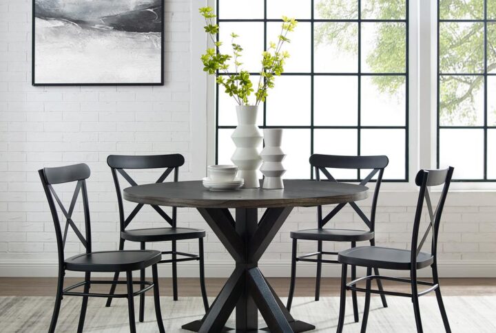 Bring modern farmhouse style to family gatherings with the Hayden Round Dining Set with Camille Chairs. Blending rustic wood and sturdy steel
