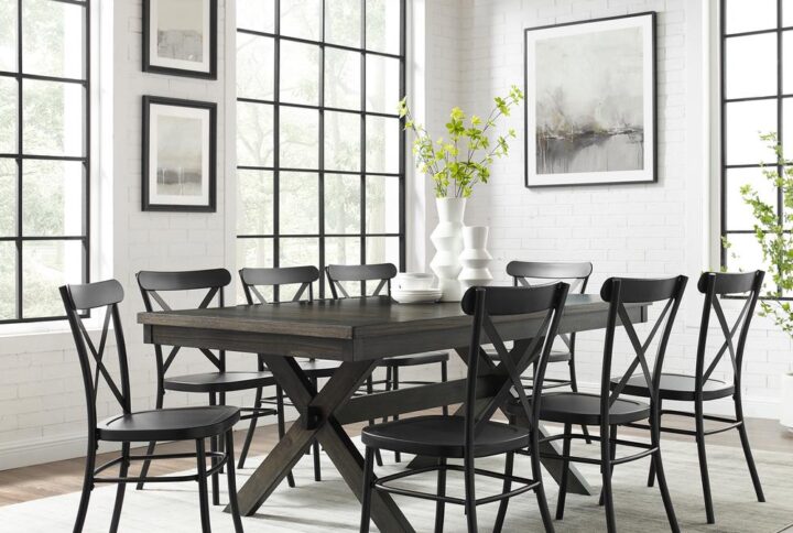 Bring modern farmhouse style to family gatherings with the Hayden Dining Set with Camille Chairs. Blending rustic wood and sturdy steel