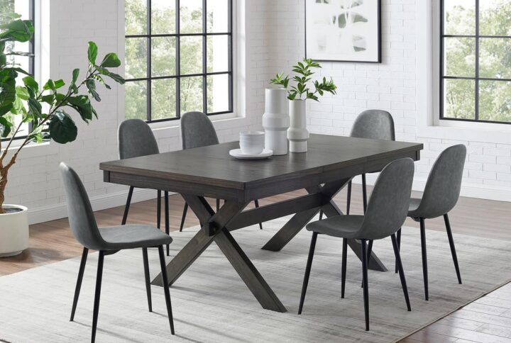The Hayden 7pc Dining Set is sure to be a showstopper with its combination of farmhouse charm and sleek modern seating. Pairing a substantial wood table with upholstered faux leather chairs