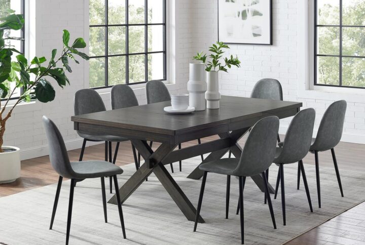 The Hayden 9pc Dining Set is sure to be a showstopper with its combination of farmhouse charm and sleek modern seating. Pairing a substantial wood table with upholstered faux leather chairs