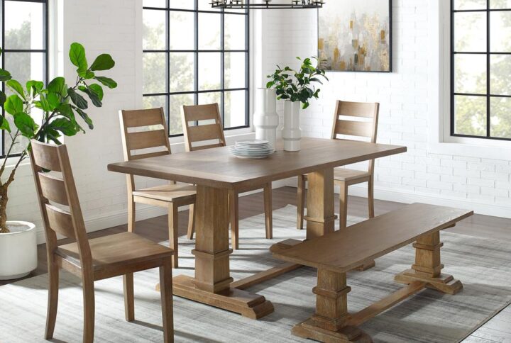 The Joanna 6pc Dining Set embodies the laid-back elegance of modern farmhouse design. Featuring a large rectangle trestle table