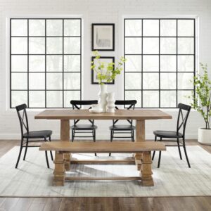 this set features a large rectangle trestle table paired with five all-metal x-back dining chairs and a wood dining bench. Mirroring the table’s substantial trestle base