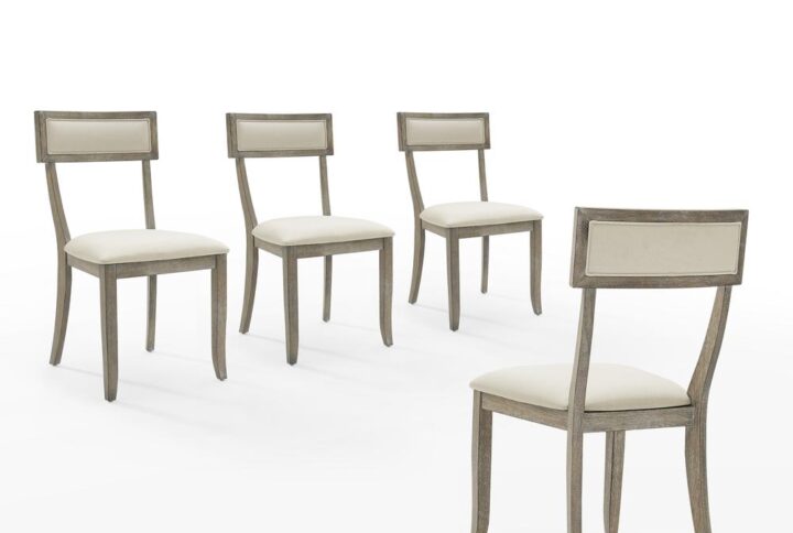 The Alessia 4-Piece Dining Chair Set is a contemporary take on Greek design. Featuring classic klismos details like a curved back and splayed legs