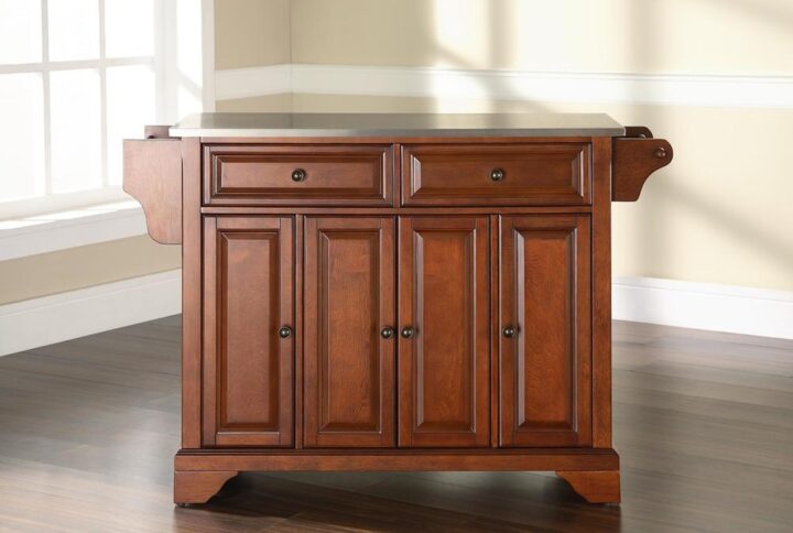 The Lafayette Full-Size Kitchen Island adds enduring style and storage to your kitchen. Featuring three cabinets