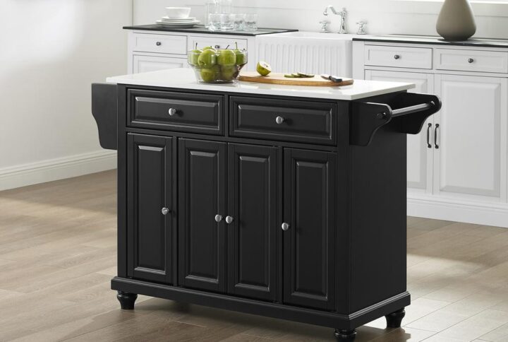 The Cambridge Full-Size Kitchen Island adds enduring style and storage to your kitchen. Featuring three cabinets