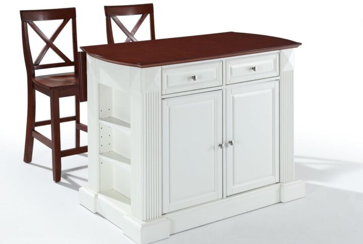 The Coventry 3pc Drop Leaf Island Set brings traditional elegance to your culinary space. Raised panels and decorative carvings on the island deliver high-end charm