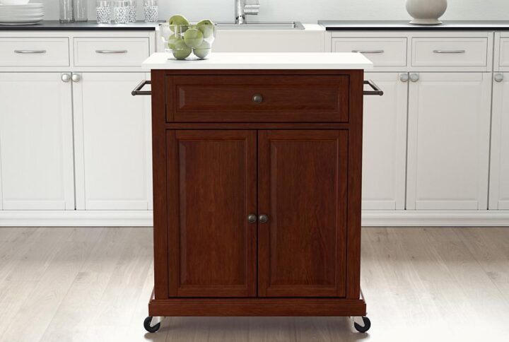 Save space while adding mobile storage with the Compact Kitchen Cart. Featuring a large cabinet with an adjustable shelf