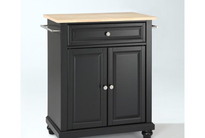 Save valuable space with the Cambridge Compact Kitchen Island. Featuring a large cabinet with an adjustable shelf