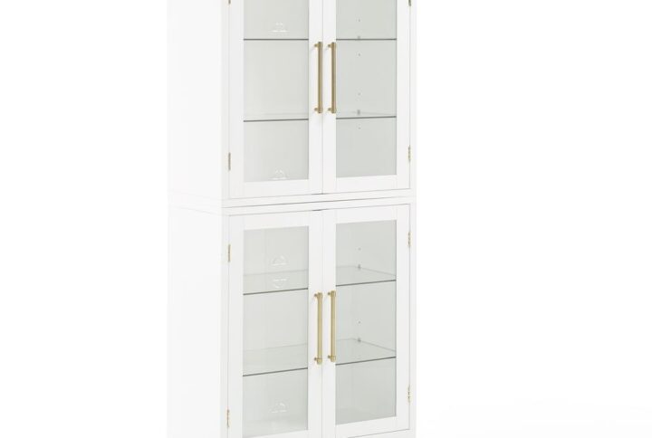The Roarke Kitchen Pantry Storage Cabinet features beautiful glass doors that display everything from keepsakes and décor to your favorite books. With four adjustable glass shelves