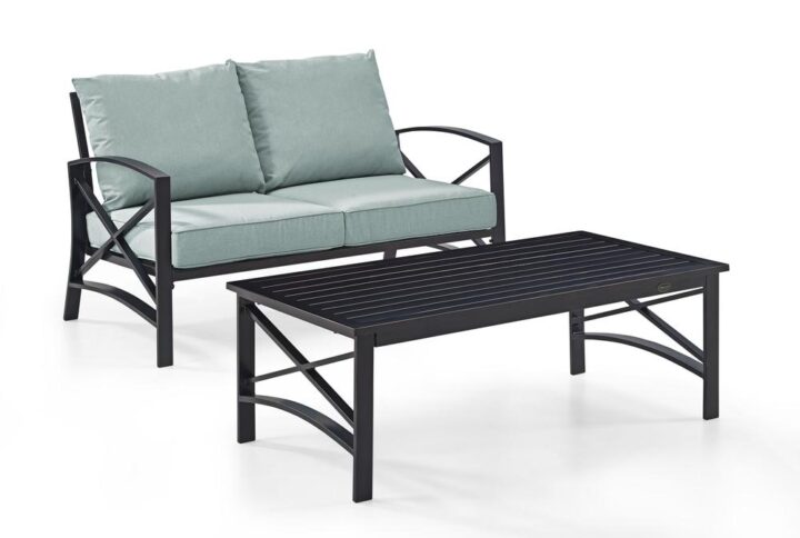 Cozy up for a relaxing chat with the Kaplan 2pc Conversation Set. Comprised of a loveseat and coffee table