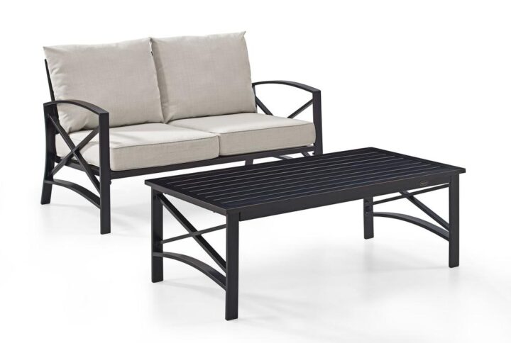 Cozy up for a relaxing chat with the Kaplan 2pc Conversation Set. Comprised of a loveseat and coffee table