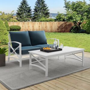 this set features sturdy steel construction with a transitional x-back design. The loveseat's comfortable seat and back cushions are covered in solution-dyed polyester