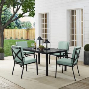 Gather around the Kaplan 5pc Outdoor Dining Set for an elegant meal al fresco. The rectangle table features a slatted design that elevates the sturdy steel construction and creates a perfect partner to the four outdoor dining chairs. Each chair showcases comfy back and seat cushions plus a classic x-back design. The table has a standard umbrella hole that will allow you to add some shade on a hot summer day. Simple and stunning
