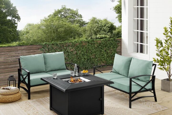 Enjoy an evening by the fire with the Kaplan 3pc Outdoor Conversation Set. Two loveseats accompany the propane-powered fire table providing cozy outdoor seating. Made from sturdy steel