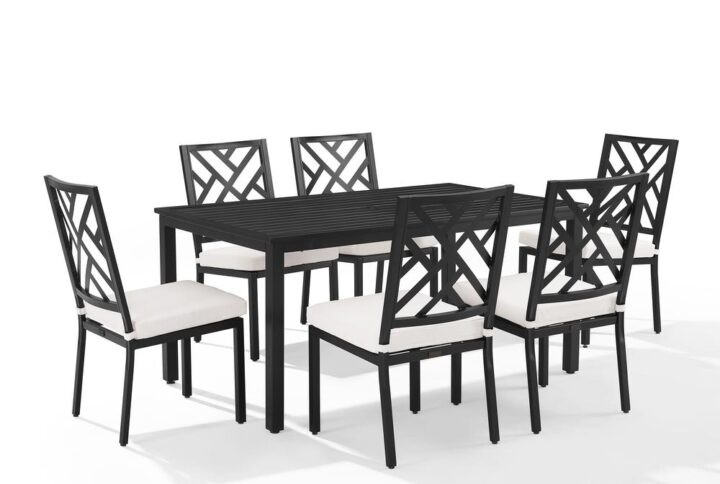 Take outdoor dining to the next level with the Locke 7pc Dining Set. Each patio chair is made from weather-resistant steel and features a classic Chippendale back with a removable seat cushion. The slatted outdoor dining table includes a hole to add a patio umbrella for dining in shaded comfort.