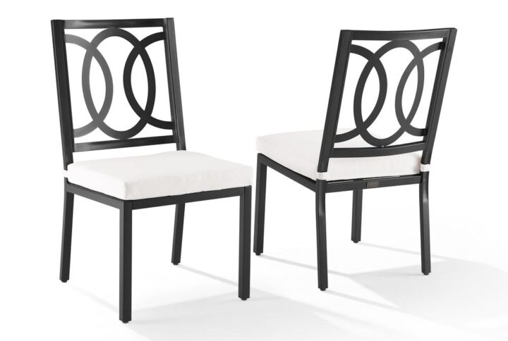 Enhance your outdoor dining space with the Chambers 2pc Dining Chair Set. Featuring an elegant back with an interlocking oval design and removable seat cushions