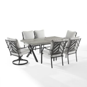 Enjoy a pleasant outdoor meal with the Otto 7pc Outdoor Dining Set. Cushioned stationary and swivel patio chairs surround the beautiful faux wood grain metal outdoor table