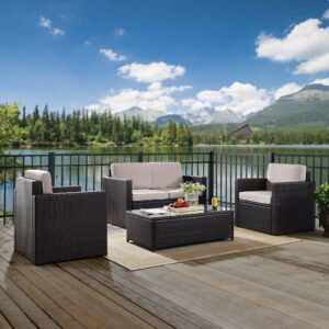 the Palm Harbor 4pc Conversation Set provides lasting comfort and style. Both the loveseat and chairs feature moisture-resistant cushions and deep seating perfect for relaxing in the summer sun. The glass-top coffee table offers ample table space for outdoor entertaining