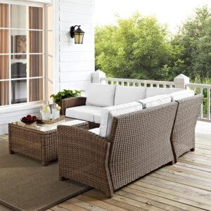 the Bradenton 4pc Sectional Set fits the bill. The sturdy steel frame of the set is wrapped in beautiful all-weather wicker and has a modular design for flexibility. Enjoy the look of bright white outdoor cushions worry-free. Featuring thick cushions covered in high-quality Sunbrella fabric