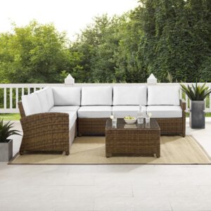 the Bradenton 5pc Sectional Set fits the bill. The sturdy steel frame of the set is wrapped in beautiful all-weather wicker and has a modular design for flexibility. Enjoy the look of bright white outdoor cushions worry-free. Featuring thick cushions covered in high-quality Sunbrella fabric
