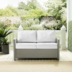 the Bradenton Loveseat fits the bill. The sturdy steel frame is wrapped in beautiful all-weather wicker with gently arched arms for comfort. Enjoy the look of bright white outdoor cushions worry-free. Featuring a thick cushion covered in high-quality Sunbrella fabric