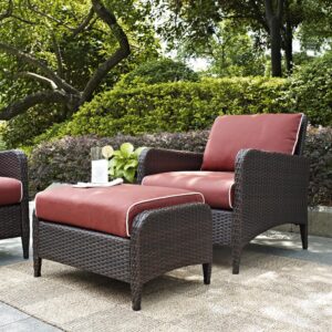 as well as the equally lush cushioned ottoman. Featuring durable powder-coated steel frames covered in beautiful all-weather wicker