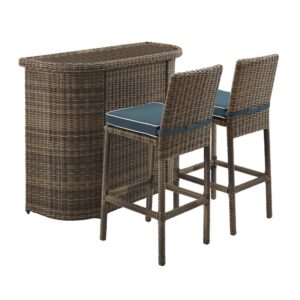 this outdoor bar and stool set is ready to play host anytime. The tempered glass top and ample shelf space of the bar create the perfect storage and serving space. The cushioned barstools offer a comfortable perch for casual dining or enjoying a drink with a friend. Add the Bradenton bar set to your patio or deck for stylish entertaining.
