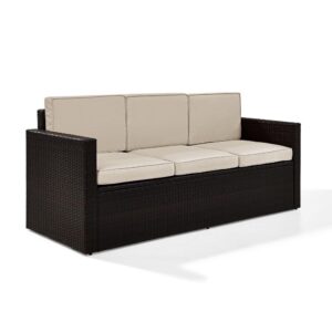 Lounge in comfort on the Palm Harbor Outdoor Sofa. Crafted with all-weather resin wicker woven over a durable steel frame