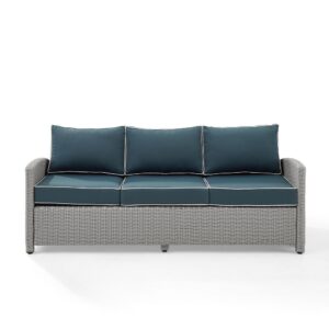 the Bradenton Outdoor Sofa fits the bill. The sturdy steel frame is wrapped in beautiful all-weather wicker and topped with moisture-resistant cushions. With gently arched arms and deep seating