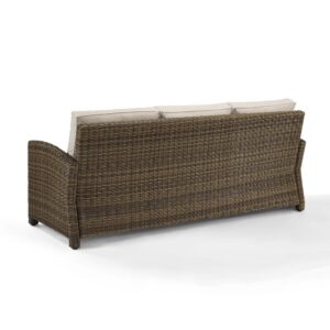 the Bradenton Outdoor Sofa fits the bill. The sturdy steel frame is wrapped in beautiful all-weather wicker and topped with moisture-resistant cushions. With gently arched arms and deep seating