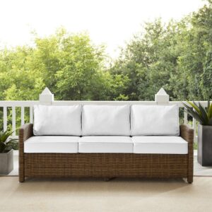the Bradenton Outdoor Sofa fits the bill. The sturdy steel frame is wrapped in beautiful all-weather wicker with gently arched arms for comfort. Enjoy the look of bright white outdoor cushions worry-free. Featuring a thick cushion covered in high-quality Sunbrella fabric