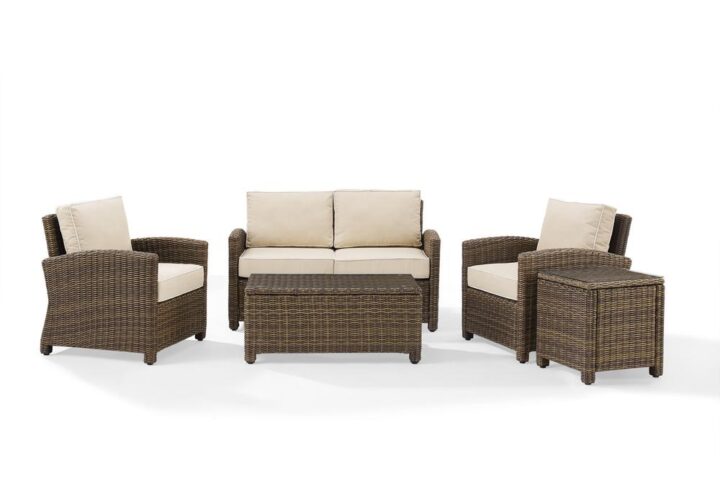 Gather with friends for an evening under the stars with the Bradenton 5pc Conversation Set.  Each piece of the set features sturdy steel frames wrapped in beautiful all-weather wicker. The loveseat and armchairs are stylish and comfortable with gently arched arms and thick moisture-resistant cushions. A glass top coffee table and side table tie the whole seating arrangement together
