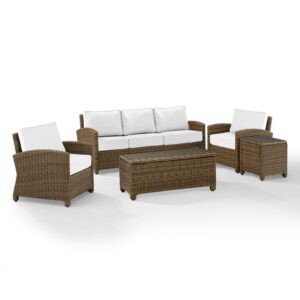Create a relaxing retreat on your patio or deck with the Bradenton 5pc Sofa Set. Each piece of the set features sturdy steel frames wrapped in beautiful all-weather wicker. Enjoy the look of bright white outdoor cushions worry-free. The sofa and armchair cushions are covered in high-quality Sunbrella fabric that resists staining