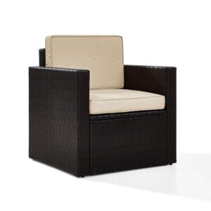 Lounge in comfort on the elegantly designed Palm Harbor Outdoor Chair. Crafted with all-weather resin wicker woven over a durable steel frame