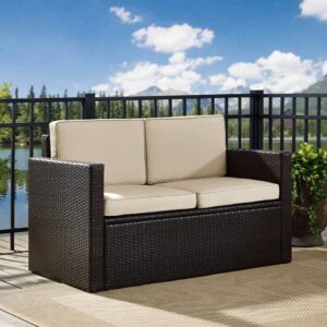 this two-seat outdoor sofa has a lasting style. With comfortable moisture-resistant cushions and deep seating