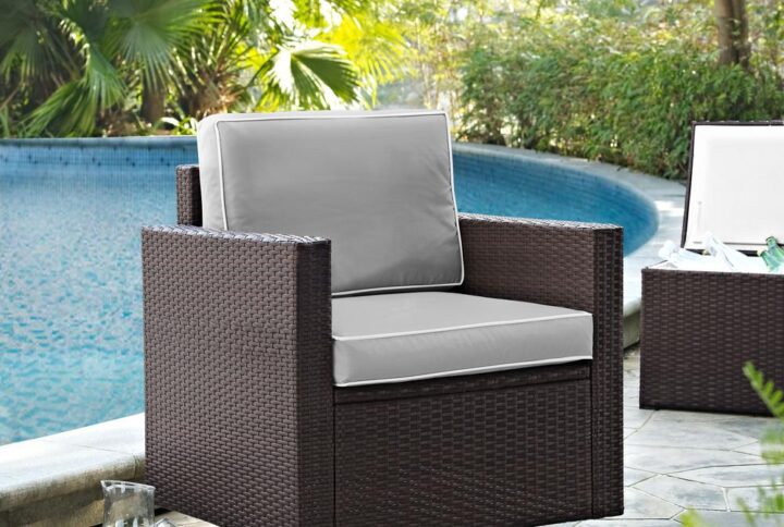 Enjoy the outdoors with the Palm Harbor Swivel Rocker Chair. Crafted from all-weather resin wicker over durable powder-coated steel