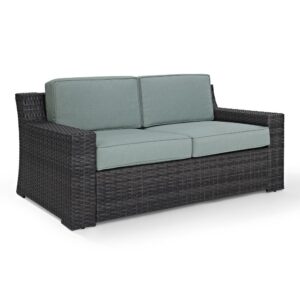 the Beaufort loveseat’s sophisticated silhouette is the perfect perch for relaxing outdoors.