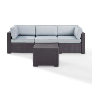 both the sofa and coffee table feature all-weather resin wicker woven over durable powder-coated steel frames.  The thick moisture-resistant cushions of the sofa offer deep