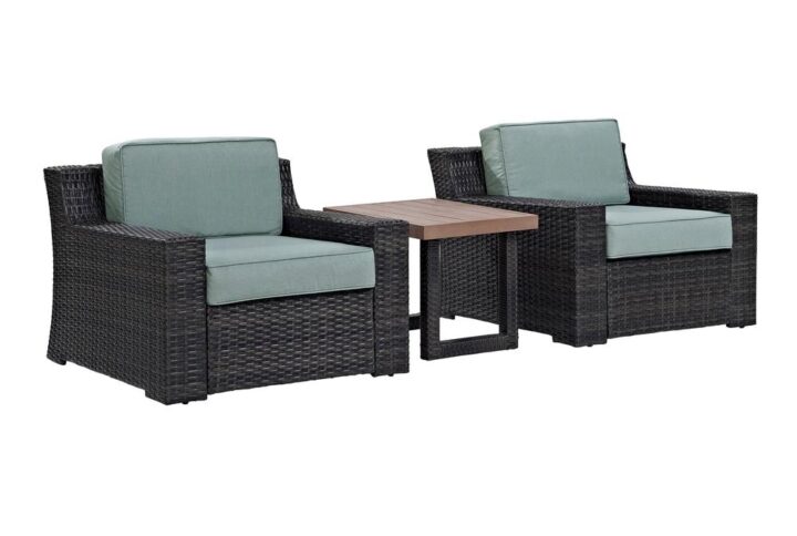 Create an instant oasis with the generous seating of the Beaufort 3pc Outdoor Chair Set. Each patio chair has beautifully woven flat resin wicker over powder-coated steel frames and thick moisture-resistant cushions. The armchairs' low-profile and understated curves complement the modern look of the side table. Featuring all-weather poly lumber planks on top and matching wicker-wrapped legs