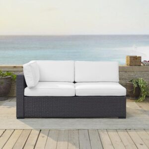 this loveseat features all-weather resin wicker woven over a durable powder-coated steel frame. Thick moisture-resistant cushions offer deep