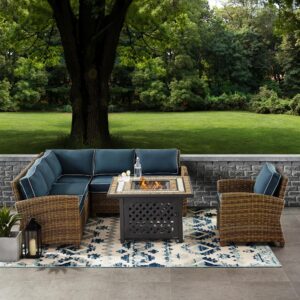 Relax in the luxury of the Bradenton 5pc Sectional Set. Seating for up to six surrounds the powder-coated steel fire table offering deep seat cushions on all-weather resin wicker. The sectional and armchair cushions are covered in solution-dyed polyester for durability and comfort. The fire table's tiled stone top and lattice paneled base offer a unique design that elevates any outdoor space. The gas controls and a rack for a propane tank are located inside the table's base
