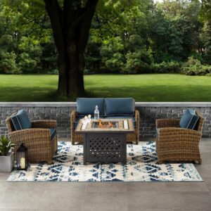 Spend warm summer days and cool summer nights with the Bradenton 4pc Conversation Set. The loveseat and armchairs are made from all-weather resin wicker with seat cushions covered in solution-dyed polyester. The outdoor seating surrounds a fire table constructed from sturdy powder-coated steel. The fire table's tiled top and lattice paneled base offer a unique design that will elevate your outdoor space. The gas controls and a rack for a propane tank are located inside the table's base