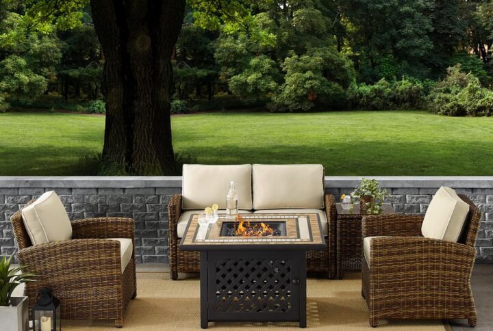 Relax by the warmth of the fire with the Bradenton 5Pc Conversation Set. The loveseat