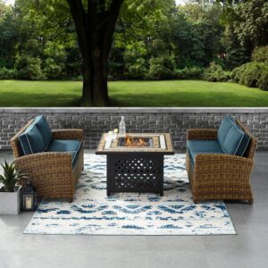 Relax by the warmth of the fire with the Bradenton 3pc Conversation Set. The loveseat and armchair are made from all-weather resin wicker with seat cushions covered in solution-dyed polyester. The outdoor seating surrounds a fire table constructed from sturdy powder-coated steel. The fire table's tiled top and lattice paneled base offer a unique design that will elevate your outdoor space. The gas controls and a rack for a propane tank are located inside the table's base