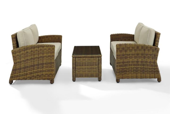 Gather with friends for an evening under the stars with the Bradenton 3pc Conversation Set.  Each piece of the set features sturdy steel frames wrapped in beautiful all-weather wicker. The loveseats are stylish and comfortable with gently arched arms and thick moisture-resistant cushions. A glass top coffee table adds a convenient spot to set a drink or snack